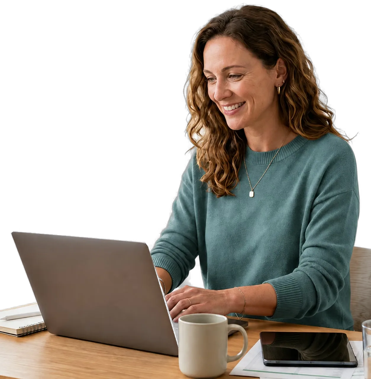 Woman working at a laptop at her desk